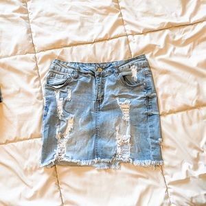 Distressed mini jean skirt